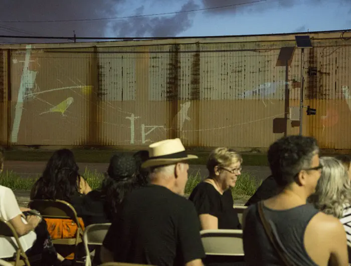 A rapt audience gathered near the campus of the Eastside's Community Family Centers, turning a parking lot into an 
al fresco cinema. The nonprofit hosted the reception, which featured a stellar lineup of food trucks including the Chocolate Wasted Ice Cream Bus. Photo Felix Sanchez. 