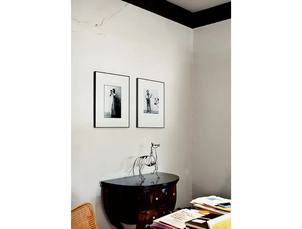 In the dining room, which is now used as a workroom, the print at left is by Mexican photographer Graciela Iturbide. At right is a print by German photographer Hans Namuth from his “Todos Santos” series. Biedermeier table, one of a pair inherited from Watriss’ mother. The wire horse sculpture was purchased in NYC in the early 1960s.