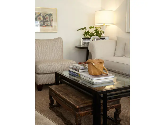 Also in the living area: an antique Chinese table, basket from Nantucket, custom designed chair by Joe Don Watts and an early lithograph by Joan Miró from Mary Ella’s collection.