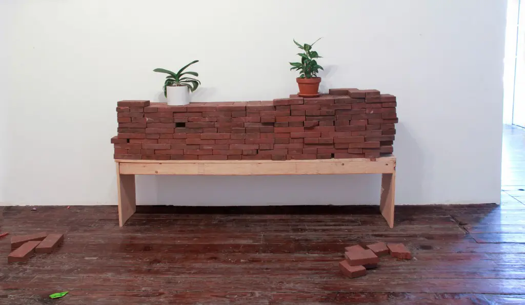 "Stand for This," 2015, is representative of Kinnaird's installation practice, which hints at approaching destruction. Photo courtesy Iva Kinnaird.