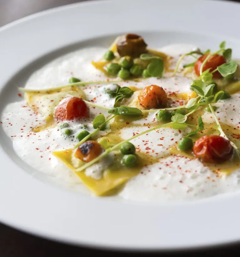 TABLE’s Spring Pea Ravioli, available on the HRW dinner menu.
The dish includes cherry tomatoes, pea shoots, fresh mint, and parmesan broth. 