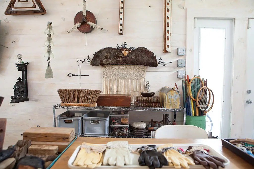 On the southern wall of the studio, a sculpture (center) will soon be delivered to a couple
for their new house. It gracefully combines two unlikely items, a delicate vintage shawl and the
rusted bottom of a 55-gallon barrel.