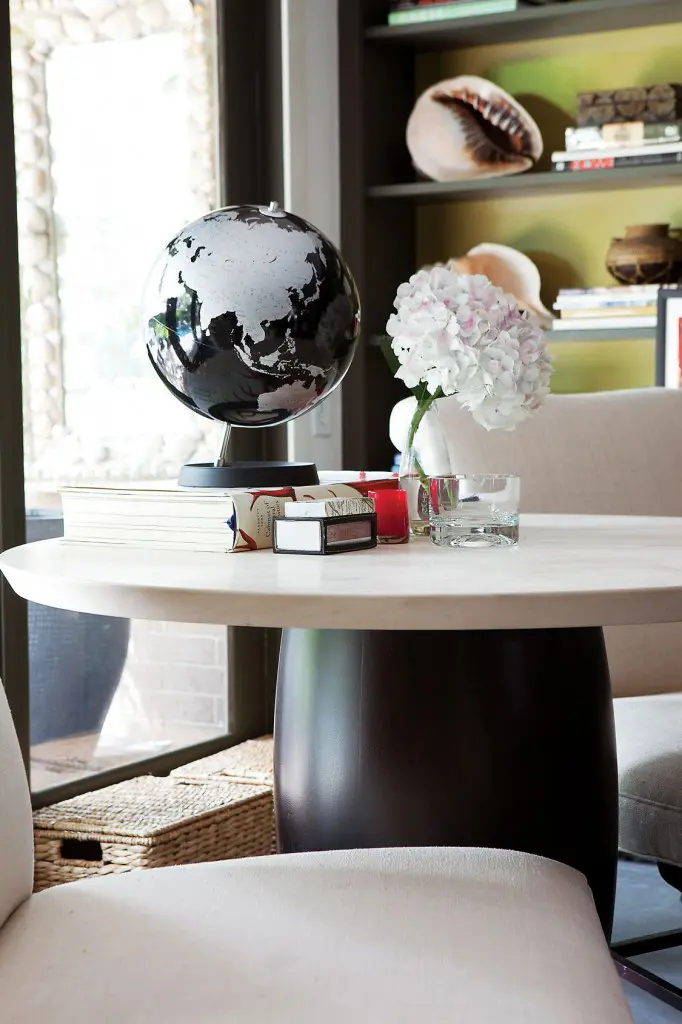 Holly Hunt limestone-and-ebonized-wood-base cocktail table.