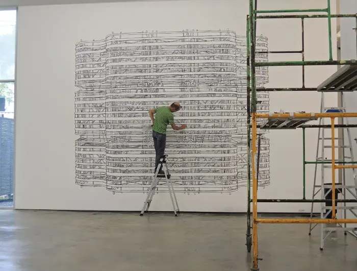 Pablo Siquier installing his 2013 exhibition "Structure" at Sicardi’s current West Alabama gallery.