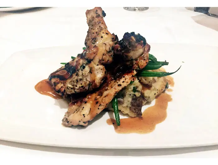 Pan roasted chicken is another second-course option at Del Frisco's. It is served with a roasted chicken jus, chateau potatoes and thin green beans.