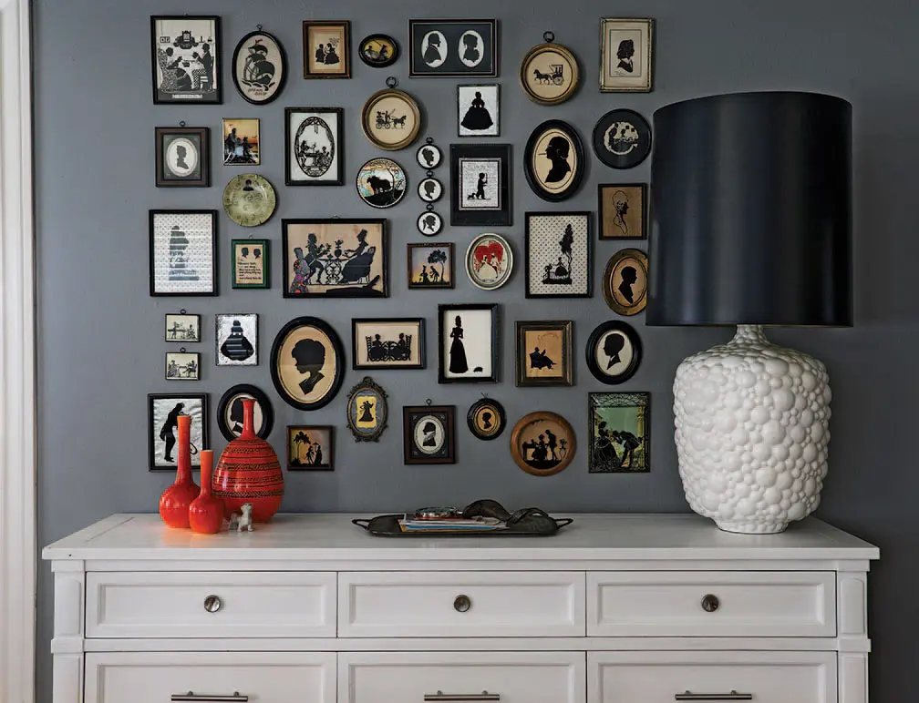 A showcase of silhouettes collected for years by Brian Sensabaugh. Vintage lamp from Metro Retro Furniture, with a ’70s shade from Nicoletti’s. Vintage credenza from Anthropologie. Vintage orange Royal Haeger pottery, circa 1919.