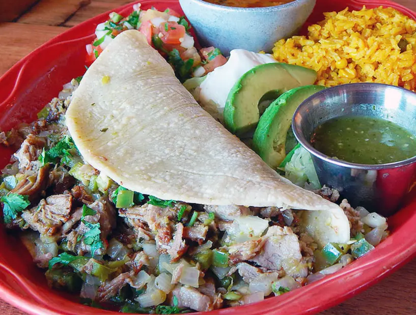Go for classic flavors like El Tiempo Cantina's pork carnitas tacos. 