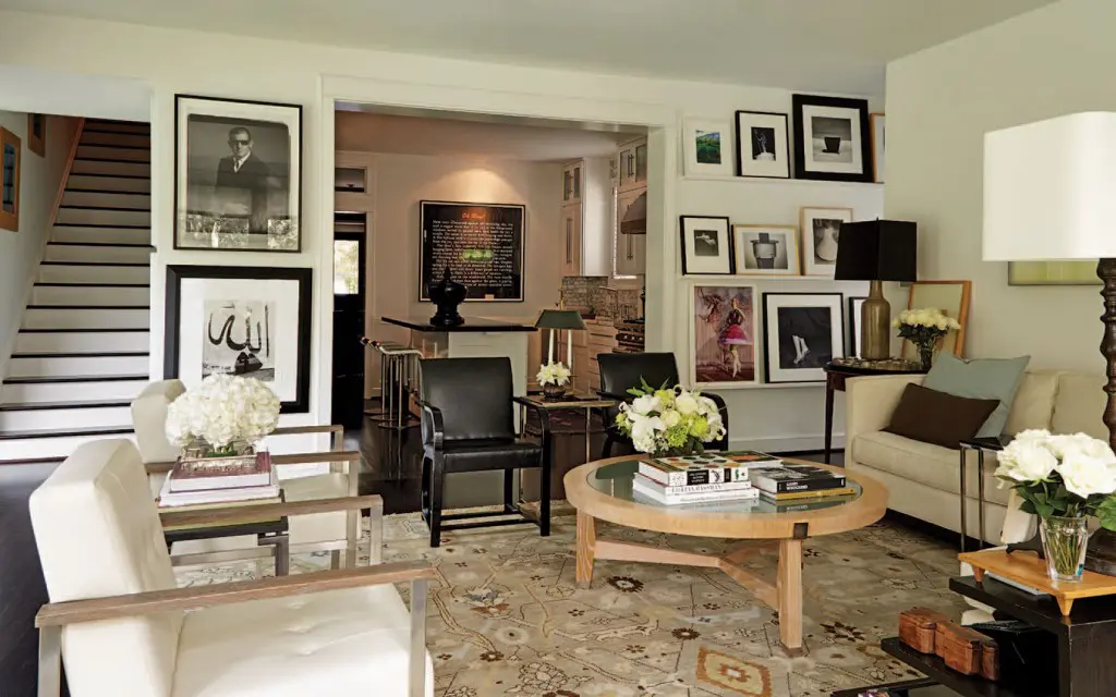 The TV room incudes a coffee table designed by Smith’s friend of 30 years, Vicente Wolf, and rug from Creative Flooring Resources. Of the many works of art on the walls is a photo by Robert Mapplethorpe and a portrait of Smith by Timothy Greenfield-Sanders (far left).