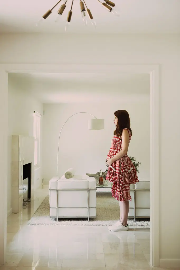 Amber Venz Box at home. Simone Rocha tweed dress $2,285, at Neiman Marcus.