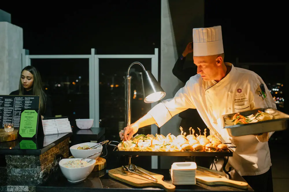 Chef Roger Benson unveils light bites for guests. 