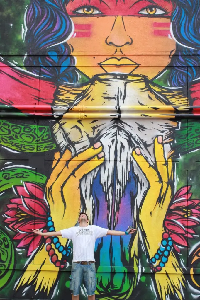 FPLO with his enormous, colorful mural. (1513 St. Emanuel)