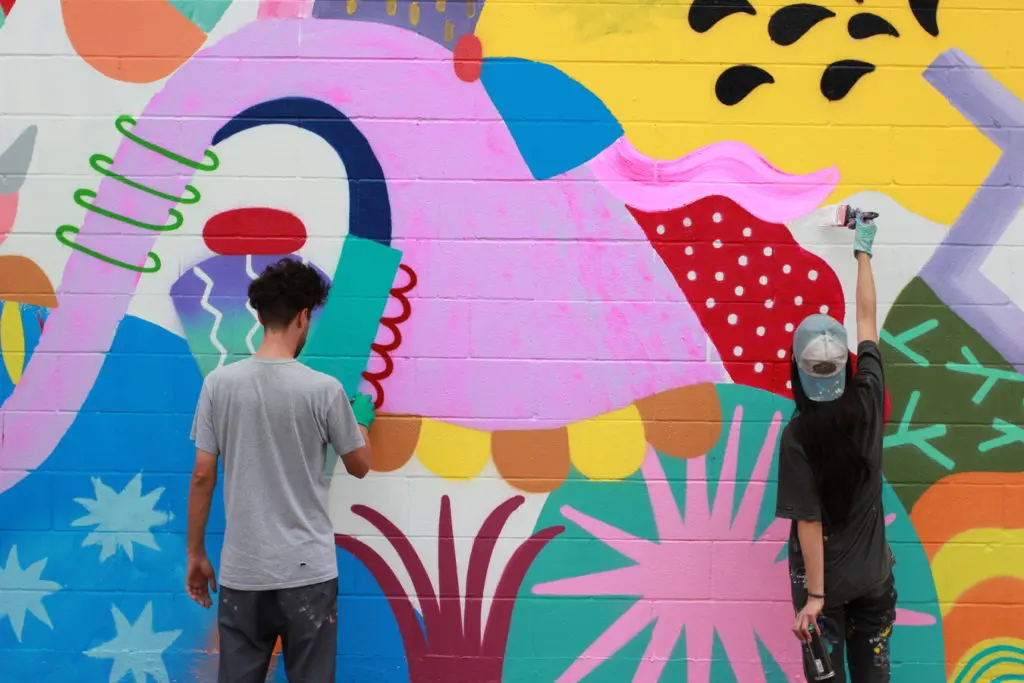 Zosen and Mina Hamada fill their murals with geometric patterns and symbols. (See them at 800 Chartres)