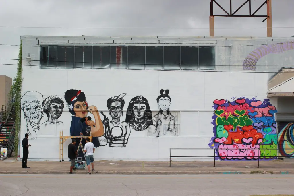 At left is Kween897's mural. To the right is New York's Indie184's colorful mural. (1513 St. Emanuel)