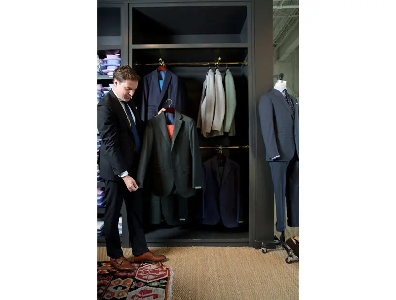 Justin Leitch admires his stylish gift pick — the flannel suit. 