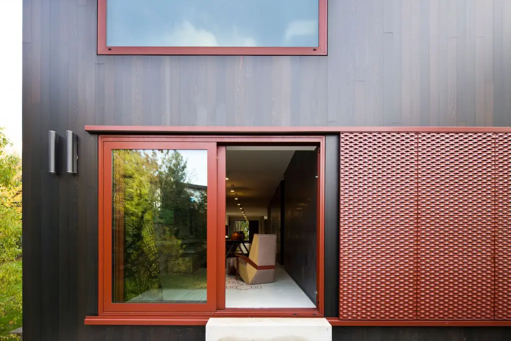 Red framed windows and doors remind Moroso of the color of leaves in fall.