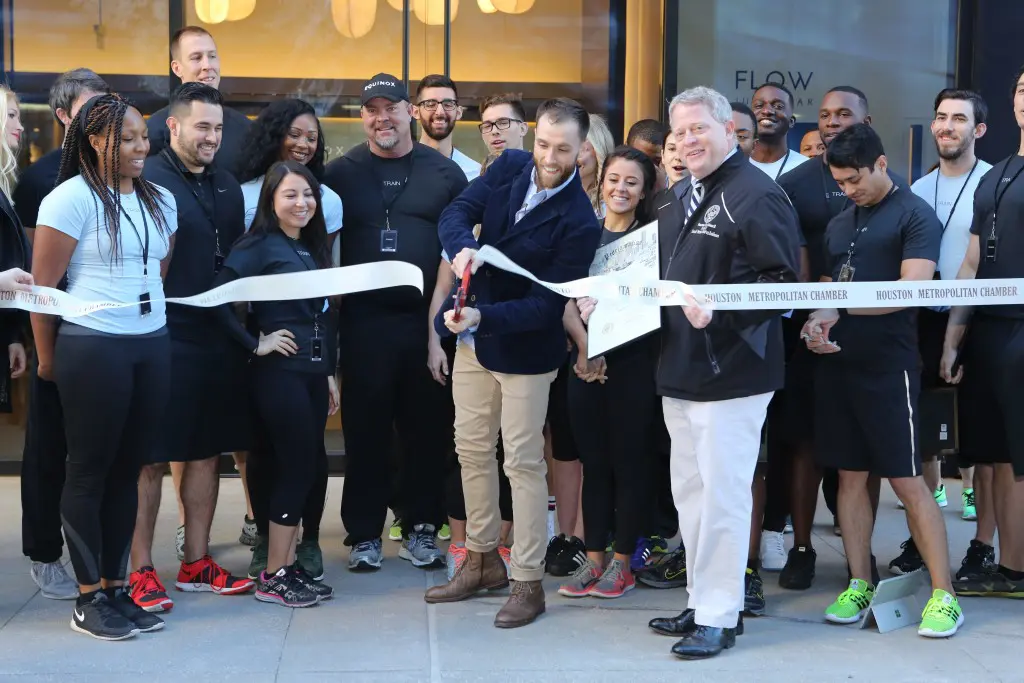 Equinox River Oaks general manager Chris Grys cuts the ribbon at the club's debut. 