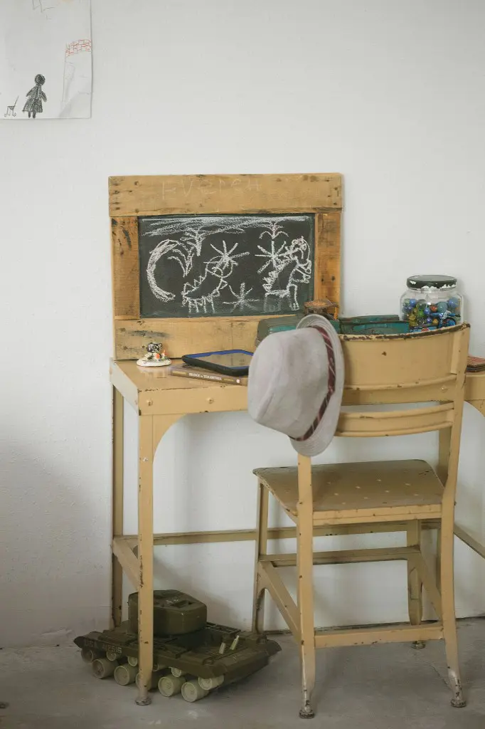 In a child’s room is a desk
from August Antiques. Vintage
truck and tank are estate sale finds.