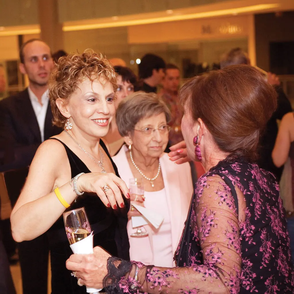 “I am drenched in Cathy Waterman with my proud mother,” says Joanne. “My hair was post-chemo, and I was happy to have it!”