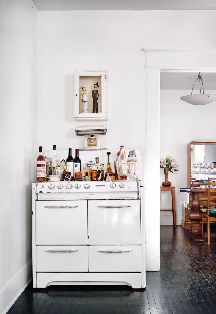 A 1950s stove in the kitchen acts as a bar; the drawers house spirits by type.
