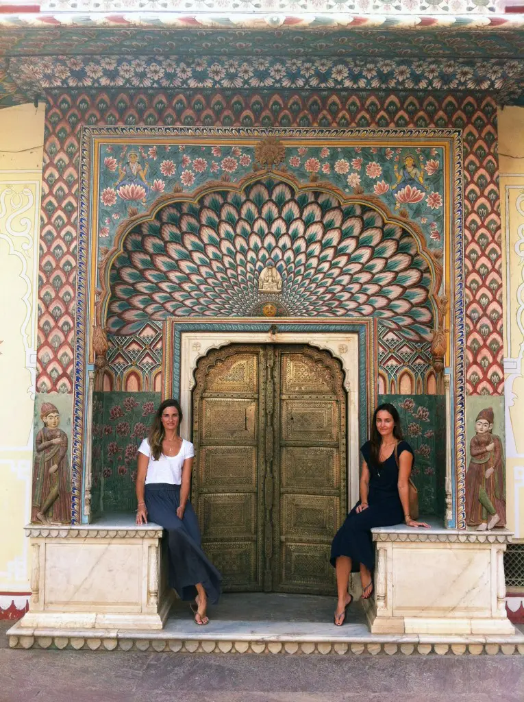 Erin Breen and Katie McClure in front of the Peacock Door at City Palace in Jaipur, India.