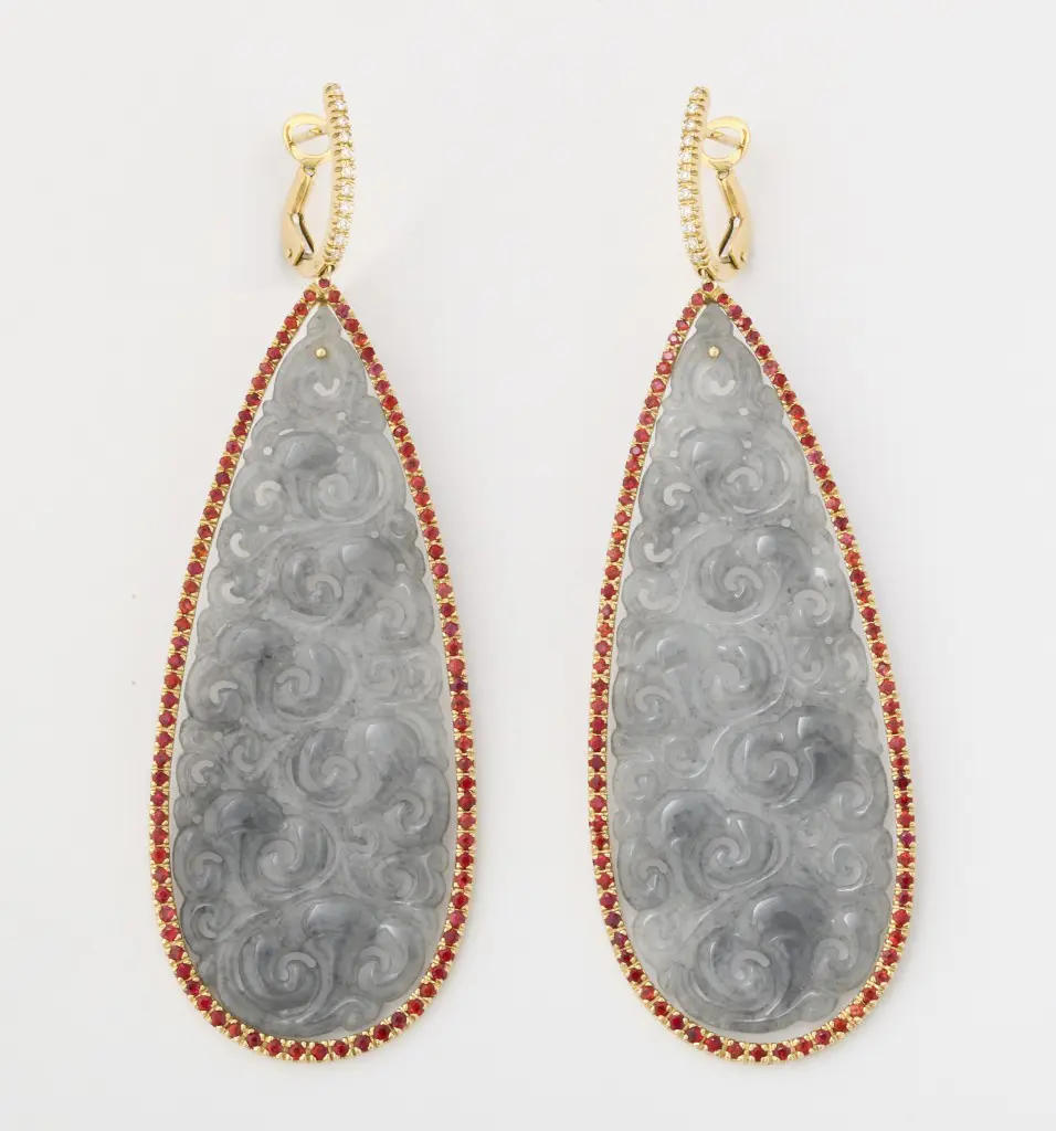 Carved jade, orange sapphire, and diamond hanging ear pendants at Michael Kanners 