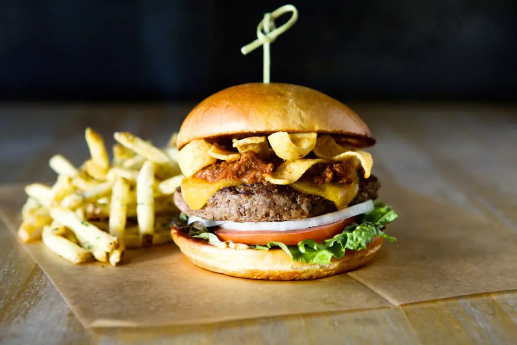 Hopdoddy Burger Bar's Terlingua burger is made with Angus beef, chile con carne, Tillamook cheddar, corn Fritos and Hopdoddy's sassy sauce. 