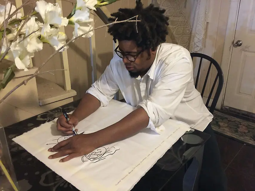 David McGee inks his Art of Food napkin. Photo Eleanor Williams, Courtesy Recipe for Success. 