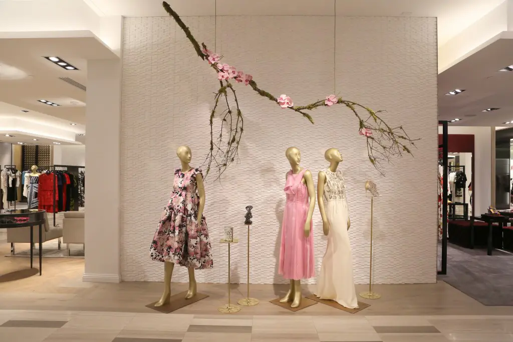 Floral style vignettes, which embrace the store's May Glam Gardens theme, line the halls of Saks.  