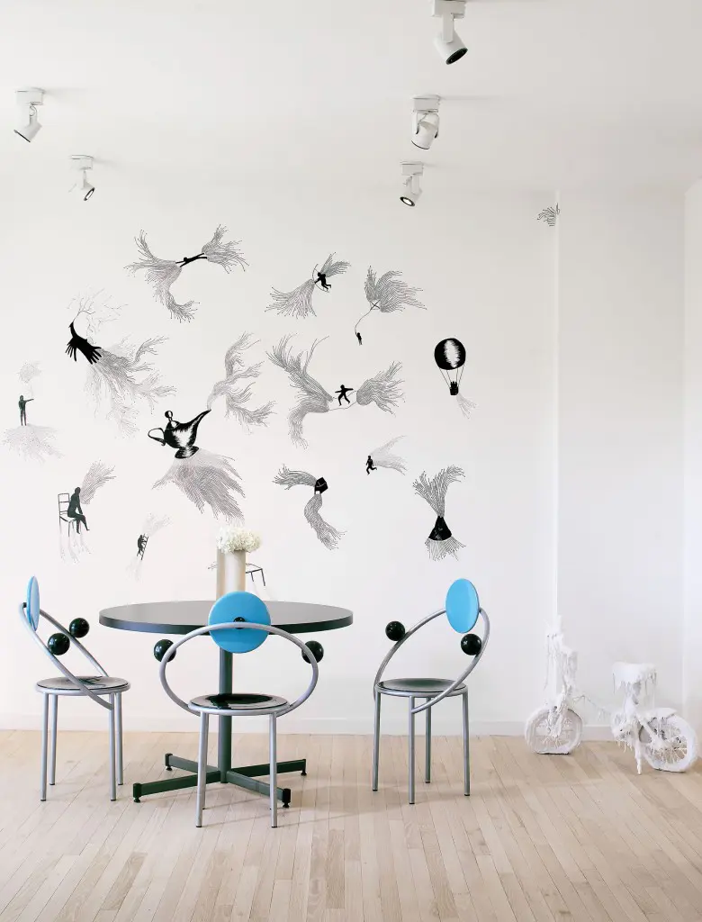 Michele De Lucchi’s Memphis table and chairs from the Memphis Milano Collection, 1983. On the wall, Andrea Bianconi’s "Aladdin’s Lamp," 2015, a site-specific drawing inspired by the fable of "Aladdin and the Wonderful Lamp." Right: Bianconi’s "Where?," 2013, a child’s bicycle encased in glue and white-enamel paint. Foreground: a sculpture by Allan Hacklin, circa 1980s. The artist played a pivotal role in Houston art history: He founded the Core Program at the Museum of Fine Arts, Houston’s Glassell School of Art.