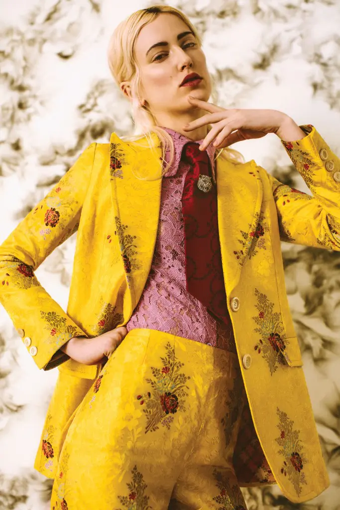 Gucci lace button-down shirt $750, Buttercup flower printed fil coupé jacket $4,690, matching boot-cut pant with ruffled cuff $1,990, red-roses-and-leaves jacquard tie $325, and pin with Swarovski crystals $580, all at the Gucci boutique, Neiman Marcus, Saks Fifth Avenue, The Webster. Artwork Matthew Satz’s "Tar and
Feather / Smoke Painting (Diptych)," 2016, at Barbara Davis Gallery, Houston.