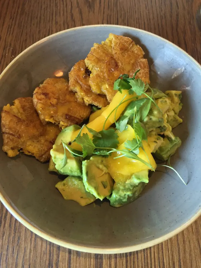 Shrimp tostones, overly dry, but the mango and cilantro are worth a taste.
