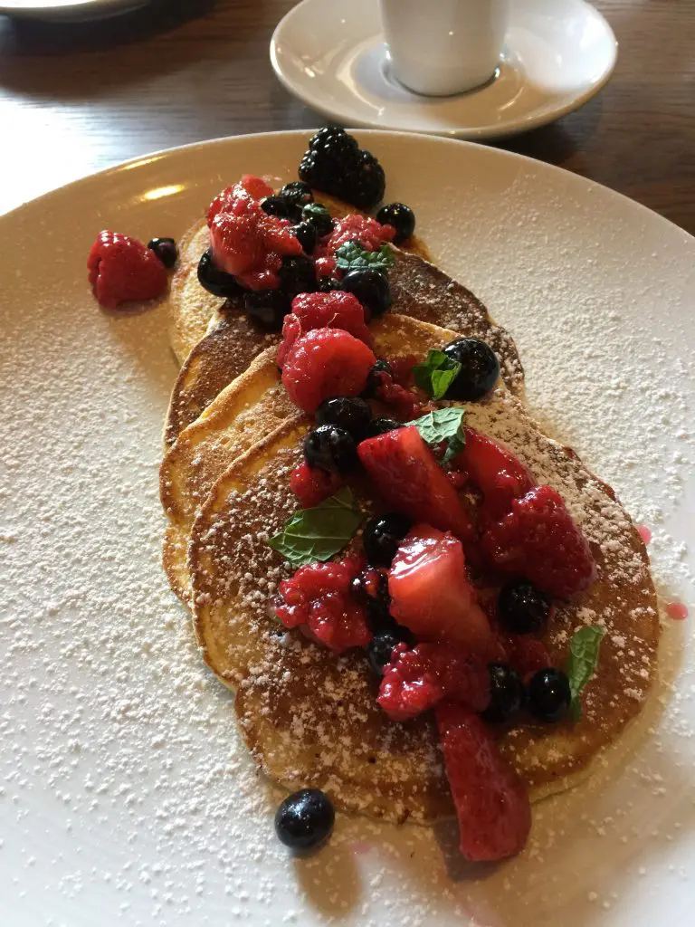 Pancake made with ricotta are moist; pour some syrup on them.