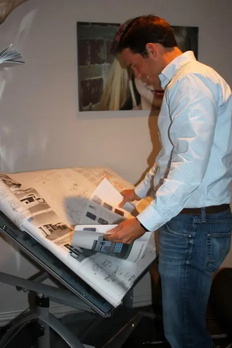 John Leggett looks over the blueprints of one of his custom homes.