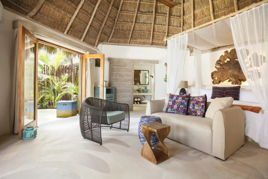 An oceanfront room with a plush king bed