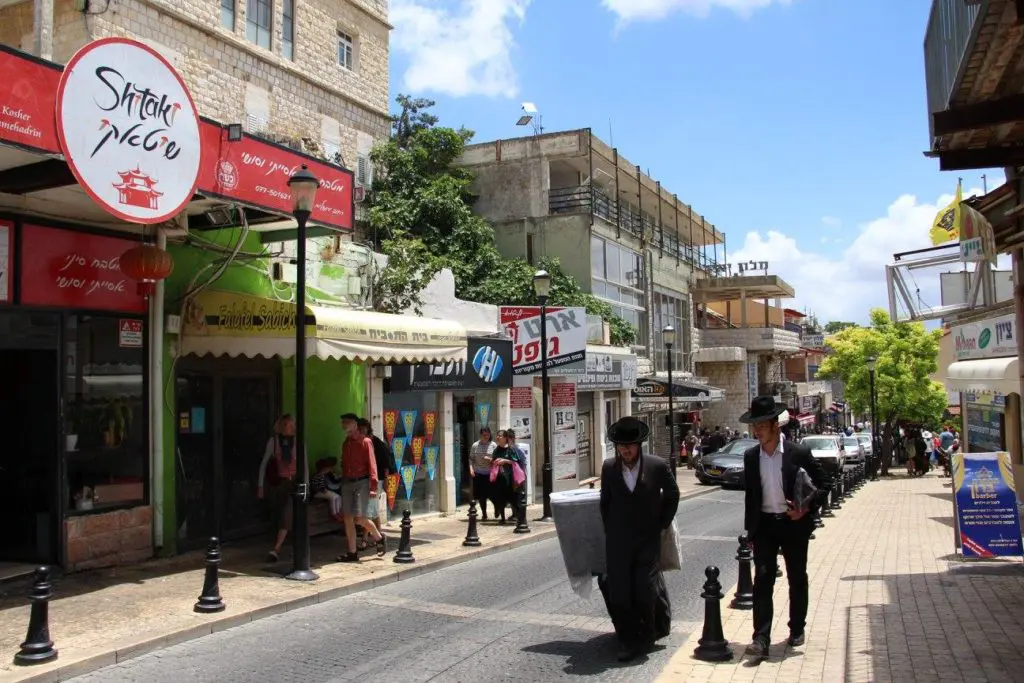 Israeli men walking in Tzfat. (Photo by Maddie Coughman)