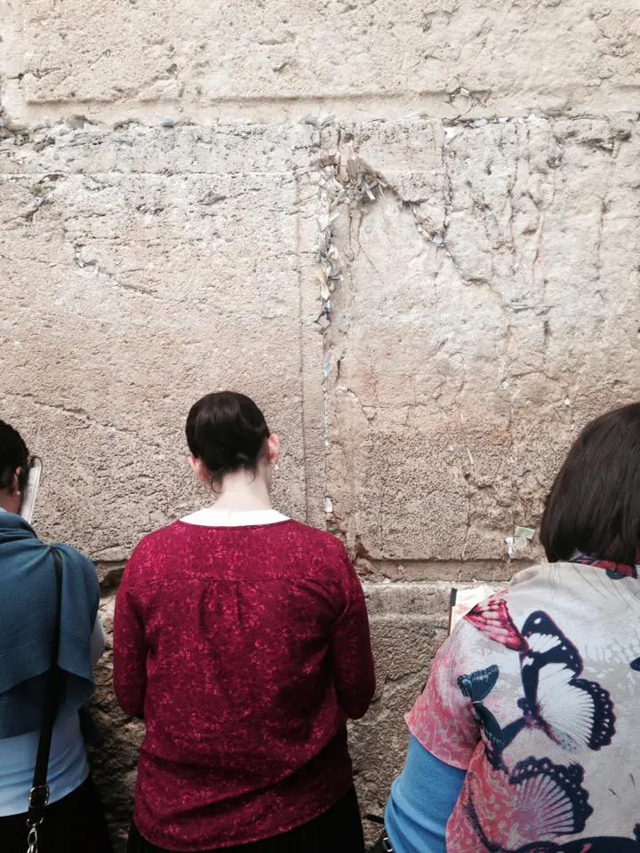 Women immersed in prayer at Wailing Wall. (Photo by Mia Davis)