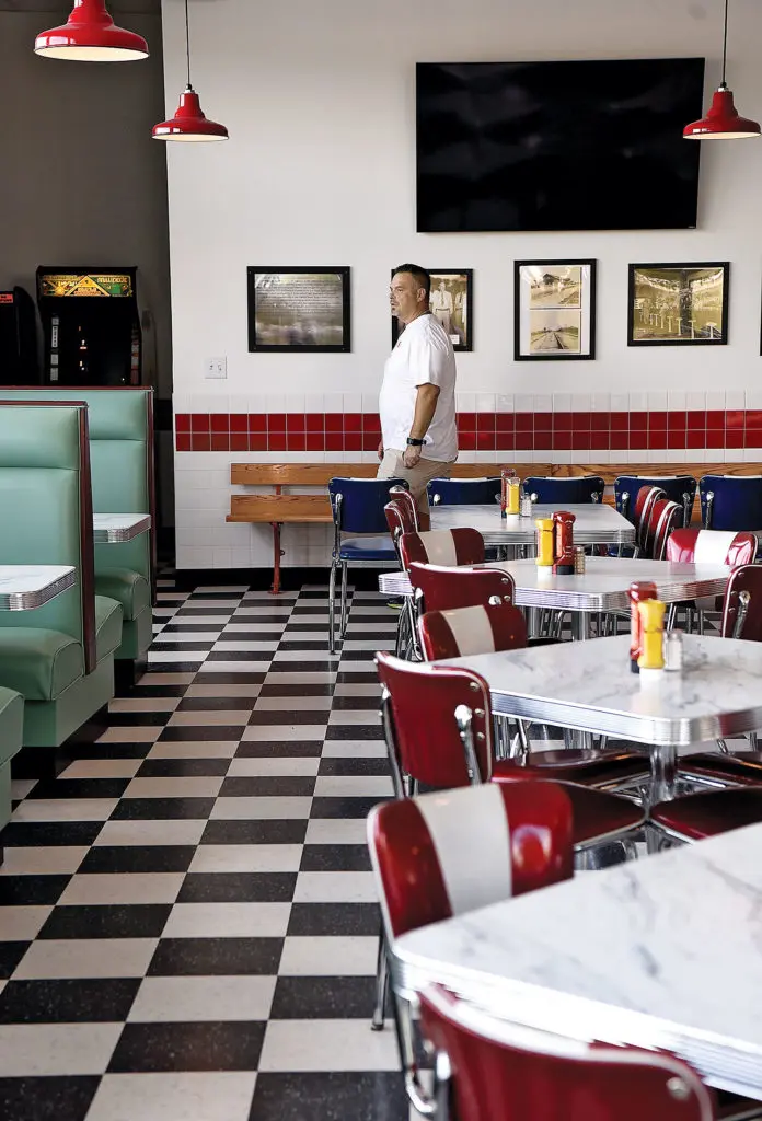 Owner Ronnie Killen surveys the scene in his Killen's Burgers.