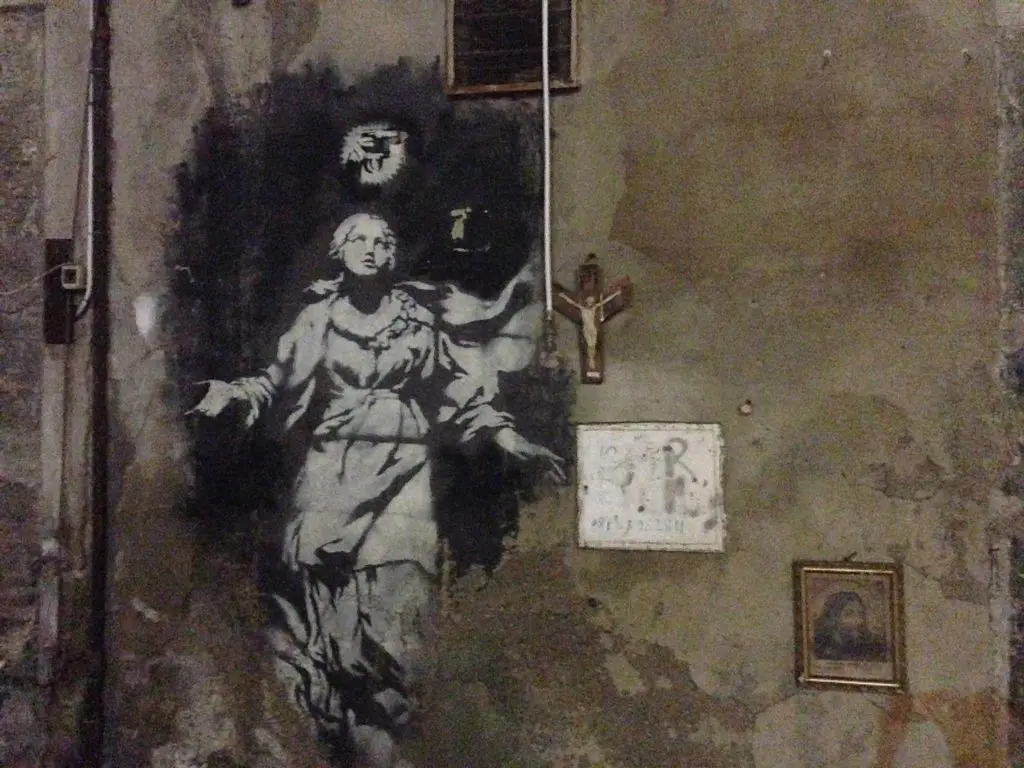 Napoli's Banksy on Spaccanoapoli, as it appeared in 2013.