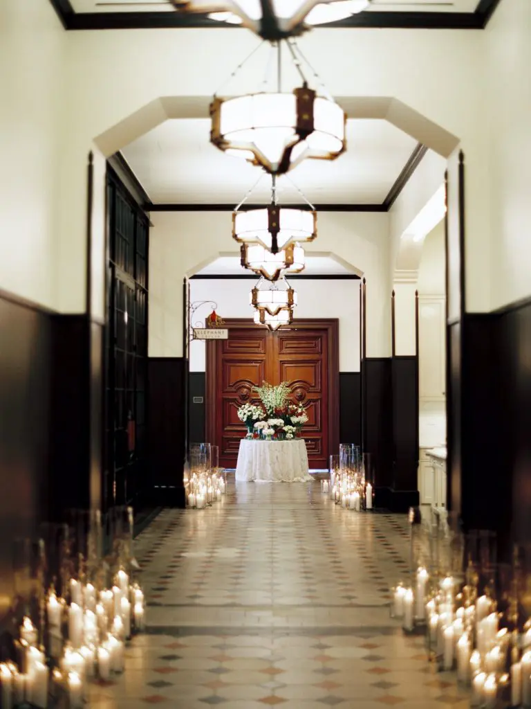 A hallway aglow with candlelight (Photo by Michelle Boyd Photography)
