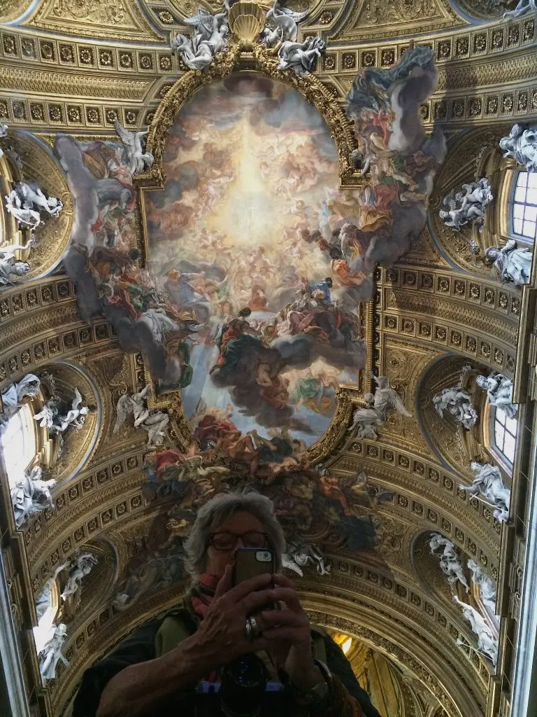 Looking upward by gazing down at a mirror. 