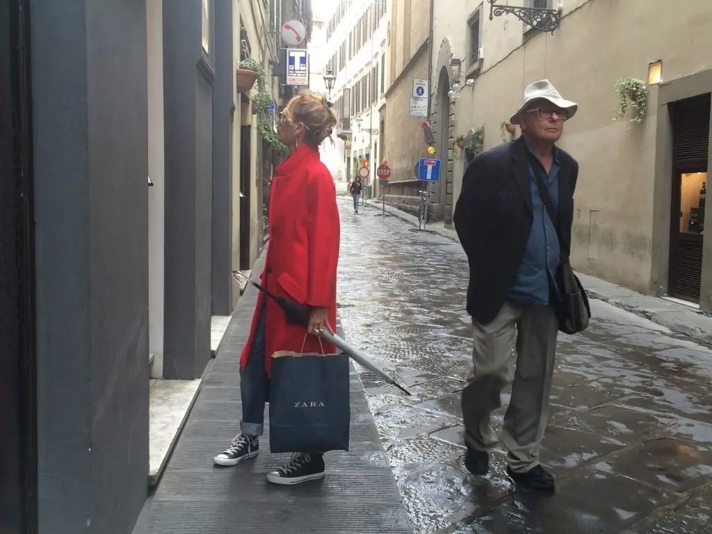 Earl passes by an elegant Florentine shopper.