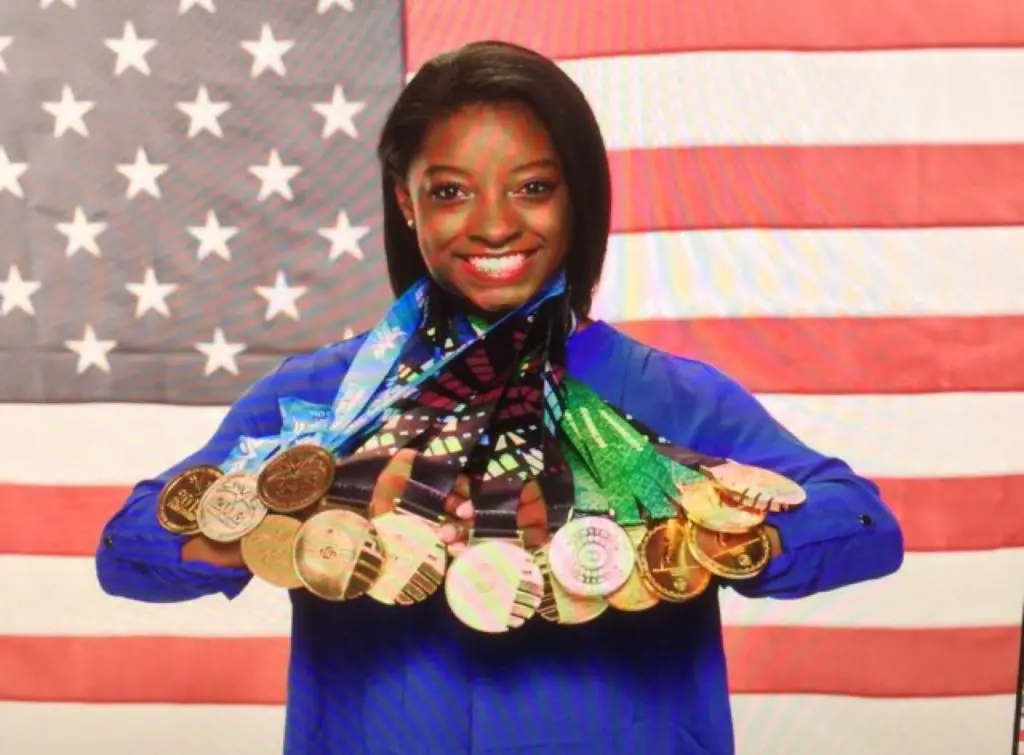 Simone Biles knows how to rack up hardware — for the U.S. and Texas.