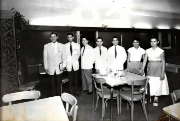 Raul Molina Jr. stand with his Molina's staff. 