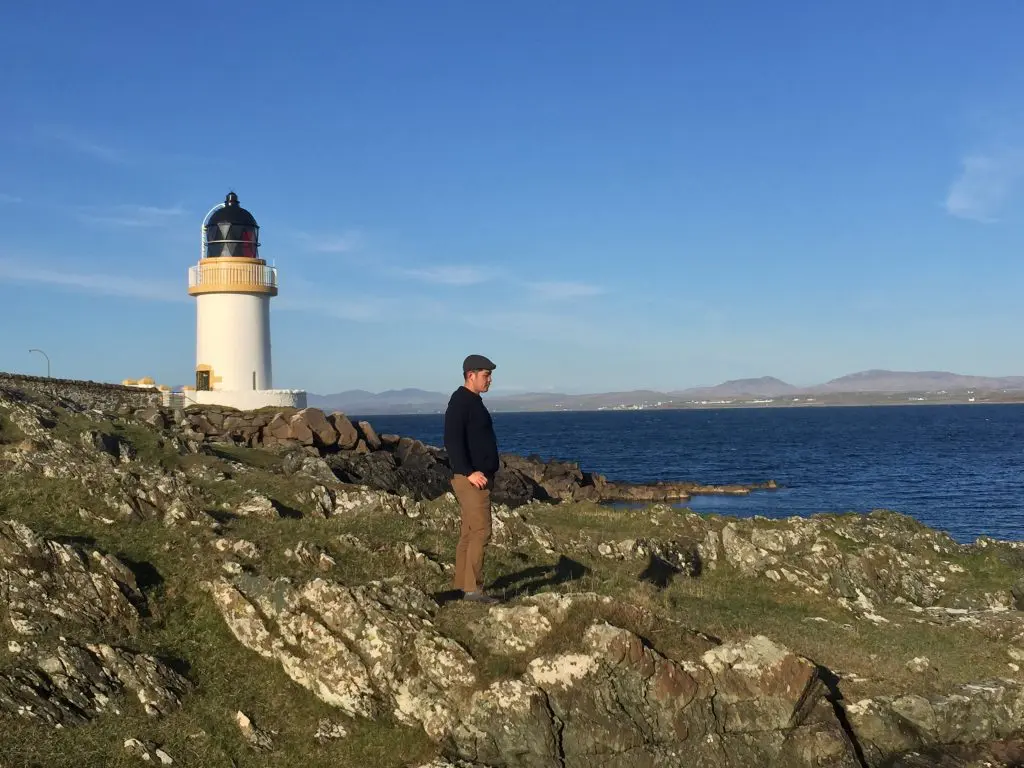 Jessey Qi in front of a lighthouse in Port Charlotte, Isle of Islay. (Photo by Bobby Heugel)