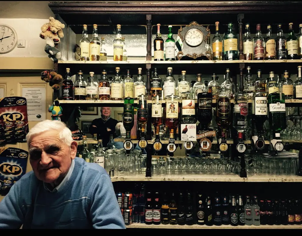 The bar at Fiddichside Inn in Craigellachie, Scotland. Bartender Joe and his wife Dorothy have worked there 50+ years.