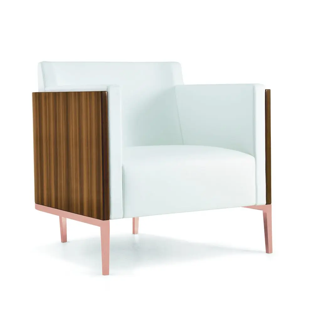 An expansive new showroom inside David Sutherland showcases Christian Liaigre’s collections of lighting and furniture, including this Shelter armchair in larch wood and polished copper.