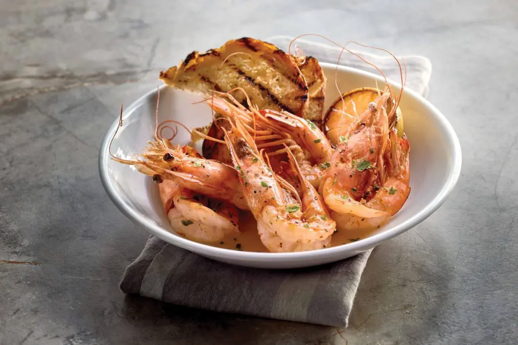 The Gamberi, which features colossal, head-on shrimp tossed in scampi gravy and served with soaking bread. 