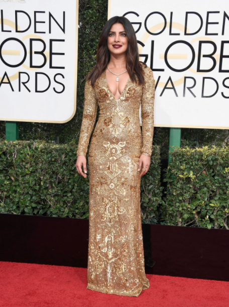 Multitalented actress Priyanka Chopra's inspires us with her gilded-baroque Ralph Lauren gown. Way to pay homage to her Bollywood roots. 