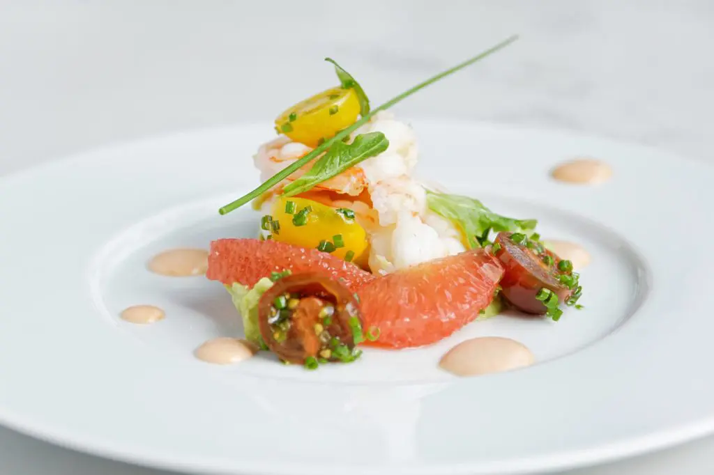 The Crevettes du Golfe — Gulf shrimp, crushed avocado, grapefruit, and tarrago cocktail sauce. 