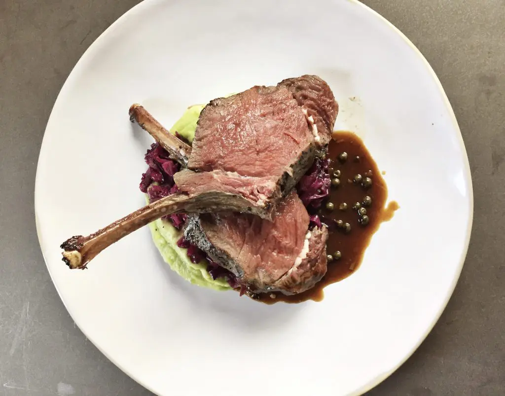 Field & Tides' roasted rack of venison is served with braised red cabbage and poblano mash.  